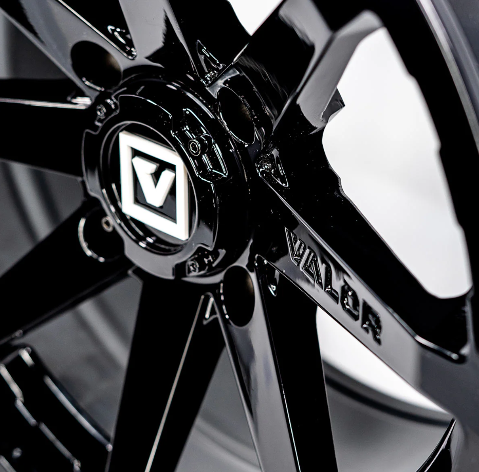 V01 14X7 +15MM 4X110 GLOSS BLACK